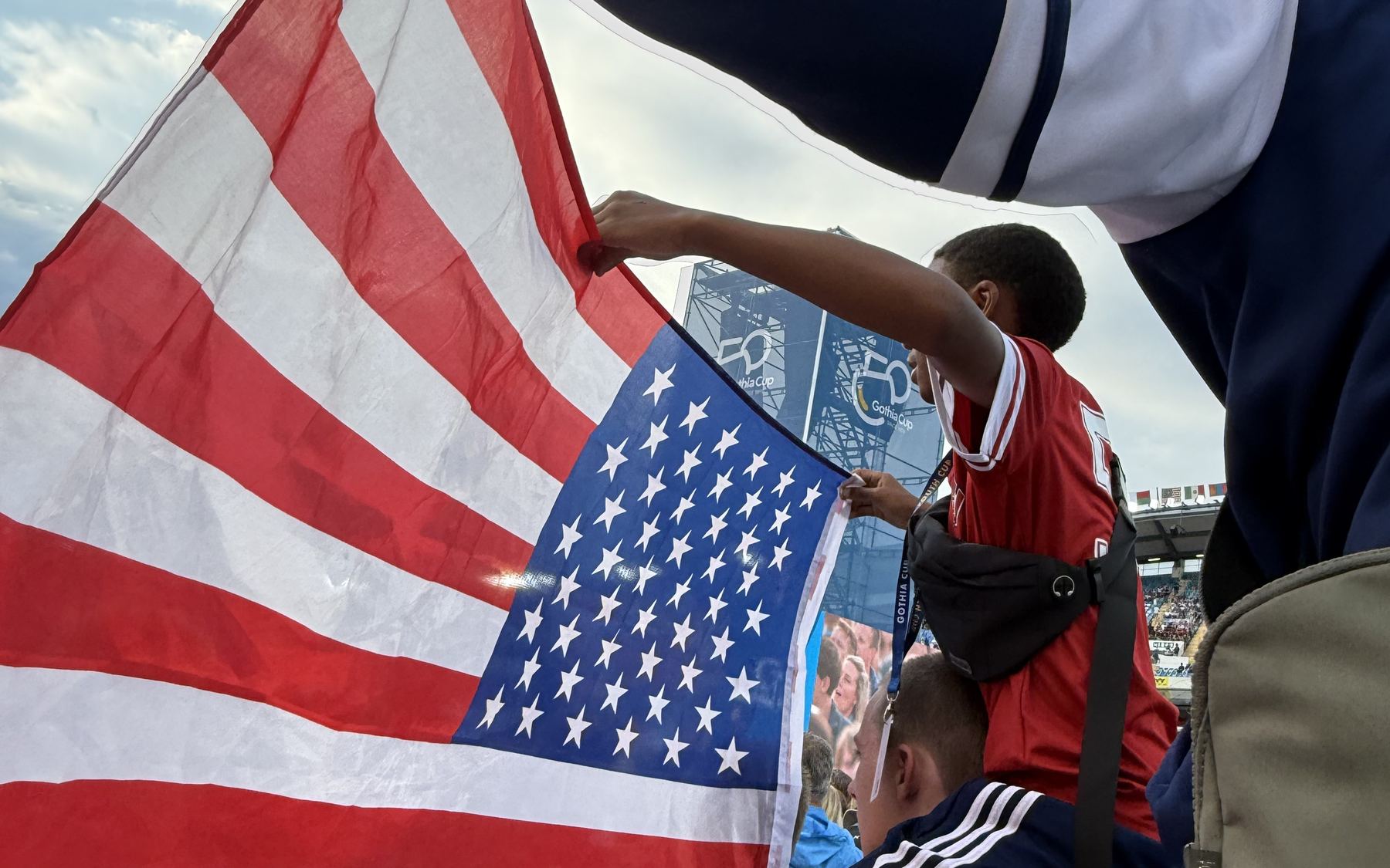 USIFC players raise an American flag inside Ullevi Stadium