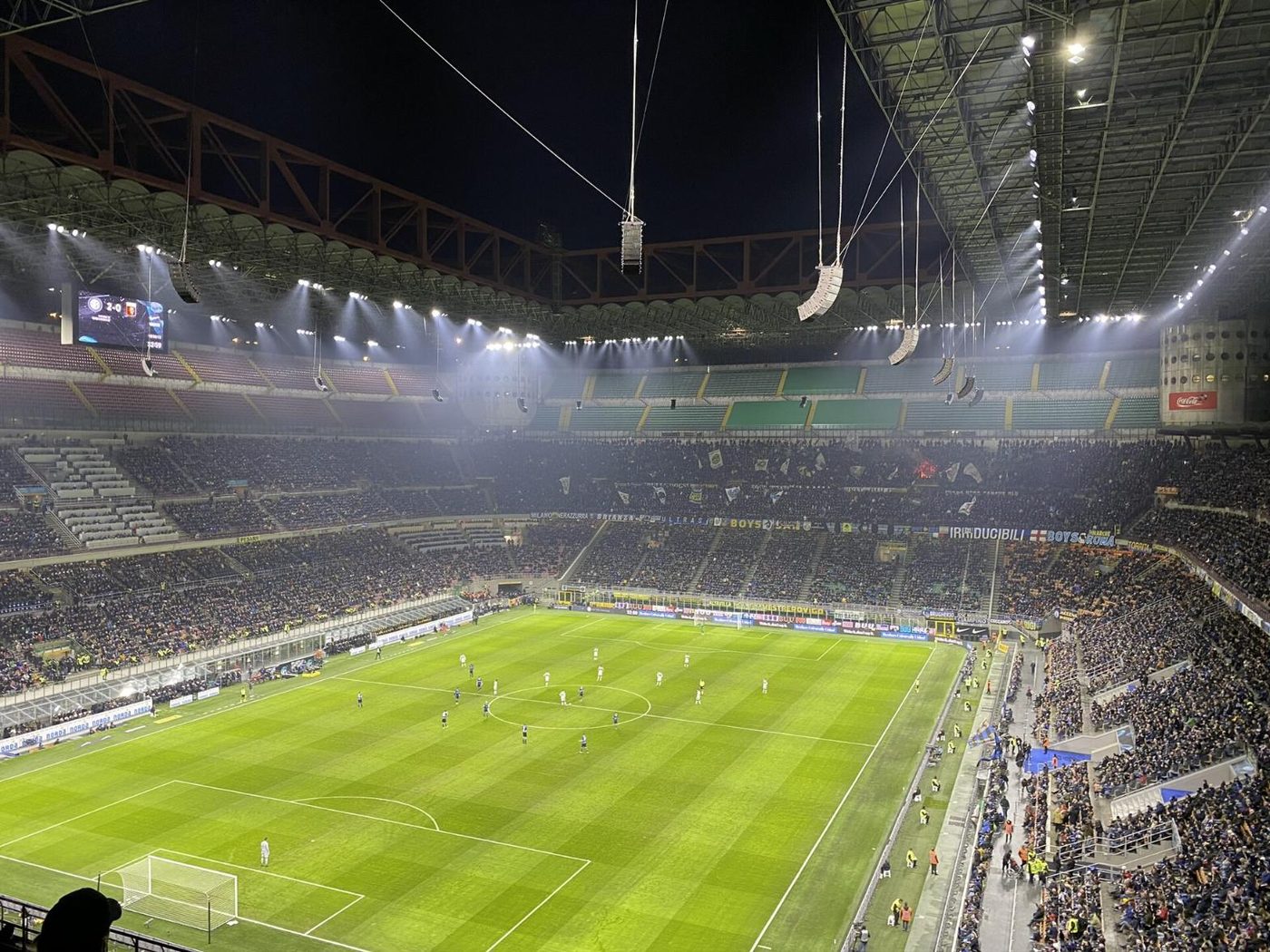 San Siro stadium in Milan, full and floodlit on a match night