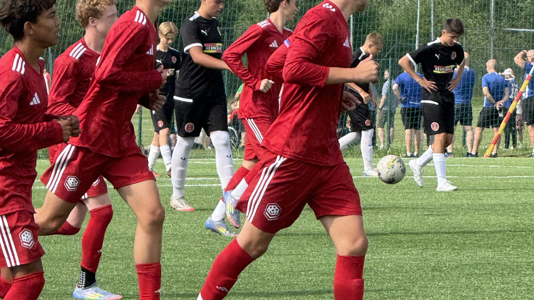 USIFC players warm up together before a match