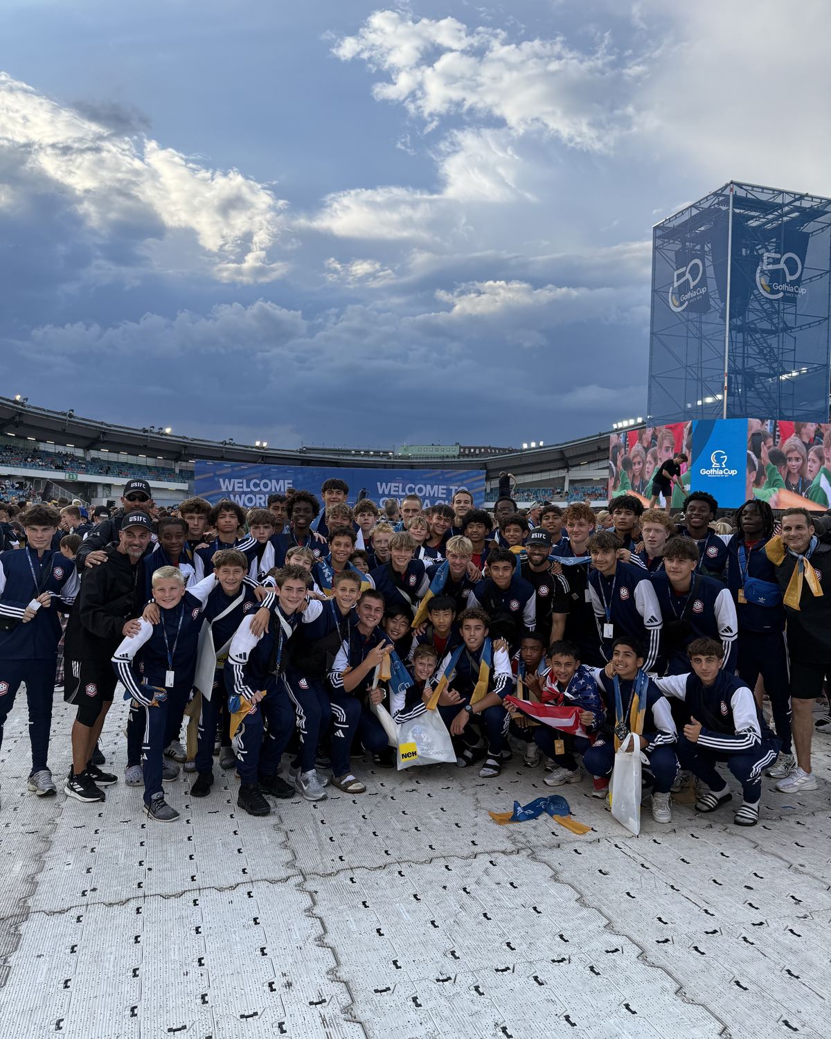 The USIFC traveling group gathered together at the stadium under a dramatic sky